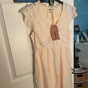 Knee length Cream colored dress